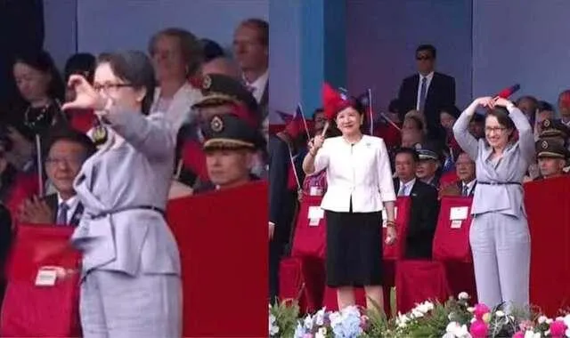 國慶大典副總統蕭美琴穿著灰色上衣搭配同色系長褲與黑色細皮帶，以中性色穿搭呈現簡潔俐落的形象。